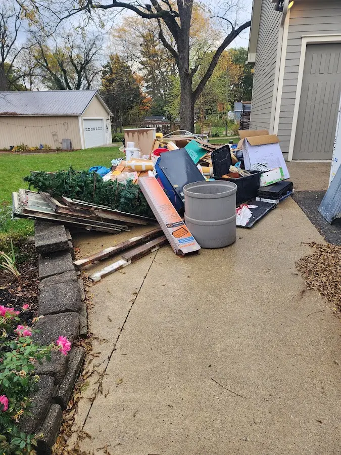 Dumpster being loaded with debris for Residential Dumpster Rental in Bloomer